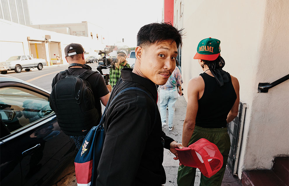 a person holding a red hat