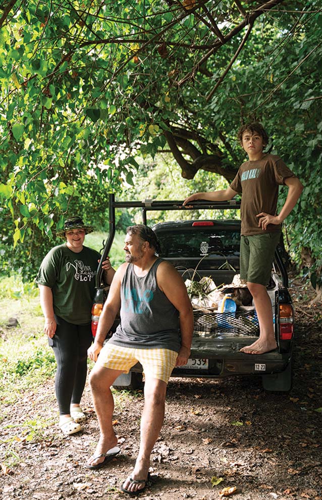 a group of people standing in the back of a truck